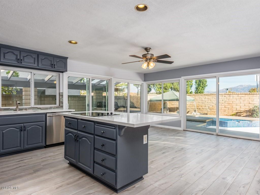 a view of a kitchen with a sink and dish washer