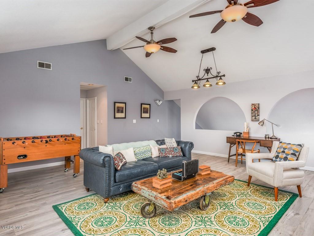 23446 Vía Barra Valencia, CA 91355 - Photo 14 of 42 a living room with furniture and a rug