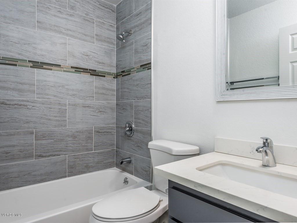 23446 Vía Barra Valencia, CA 91355 - Photo 21 of 42 a bathroom with a sink a toilet and shower
