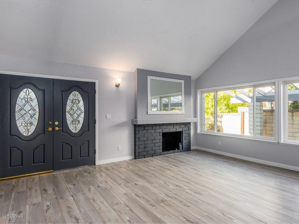 23446 Vía Barra Valencia, CA 91355 - Photo 26 of 42 a view of an empty room with a window and wooden floor