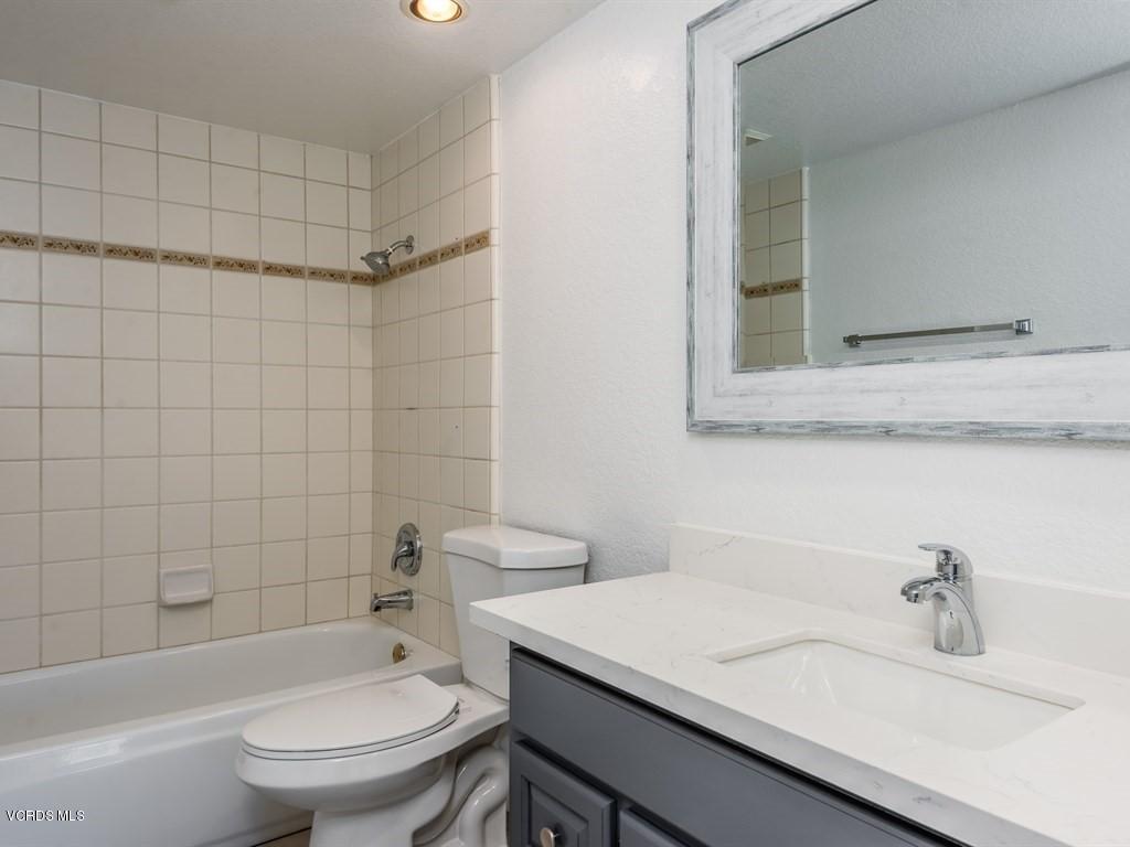 23446 Vía Barra Valencia, CA 91355 - Photo 33 of 42 a bathroom with a sink toilet vanity and tub