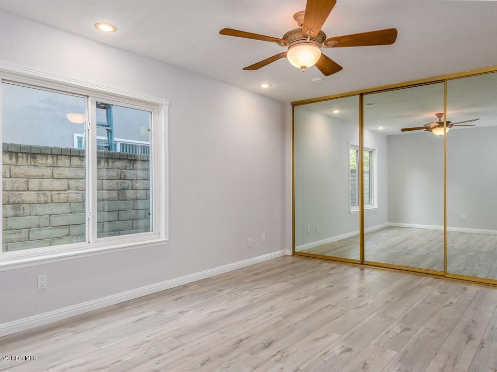 23446 Vía Barra Valencia, CA 91355 - Photo 34 of 42 an empty room with fan and windows