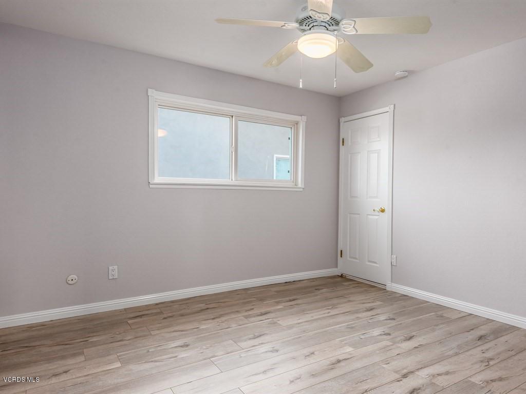 23446 Vía Barra Valencia, CA 91355 - Photo 39 of 42 wooden floor in an empty room with a window