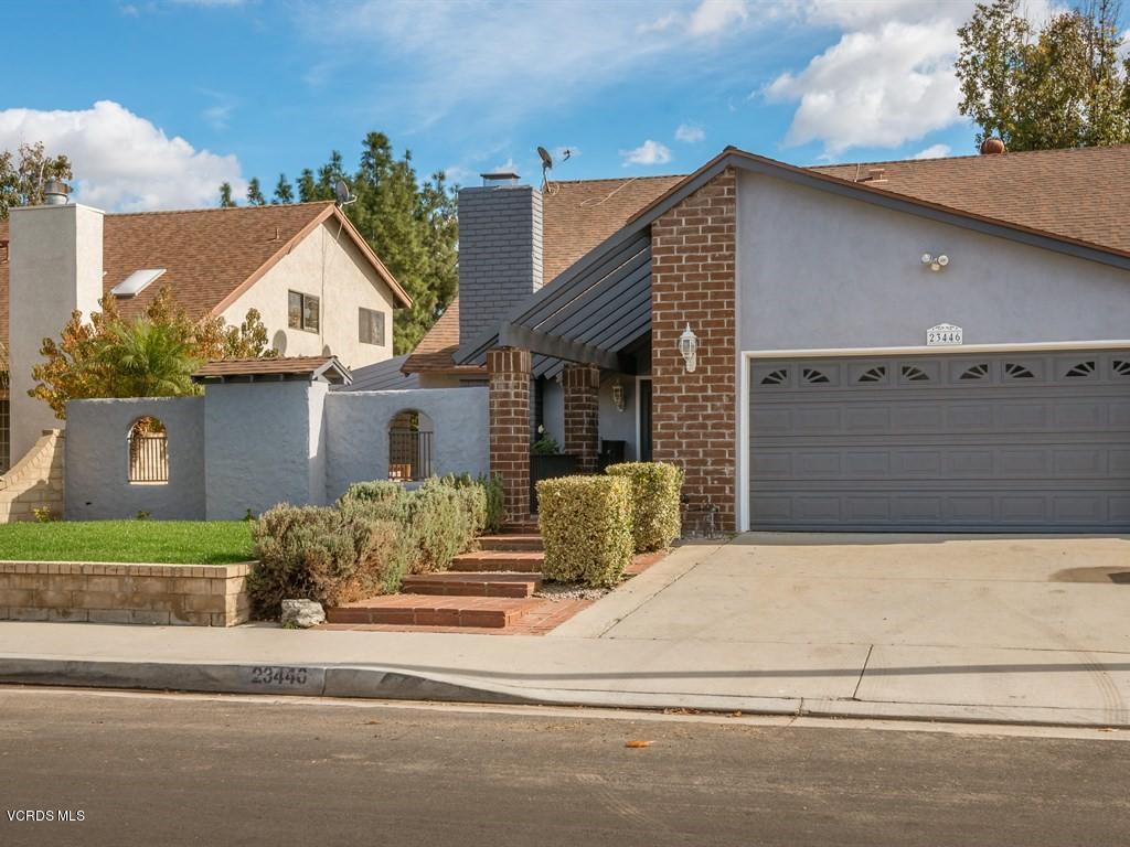 23446 Vía Barra Valencia, CA 91355 - Photo 9 of 42 front view of a house with a street