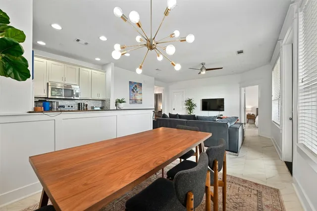 a kitchen with a table and chairs in it