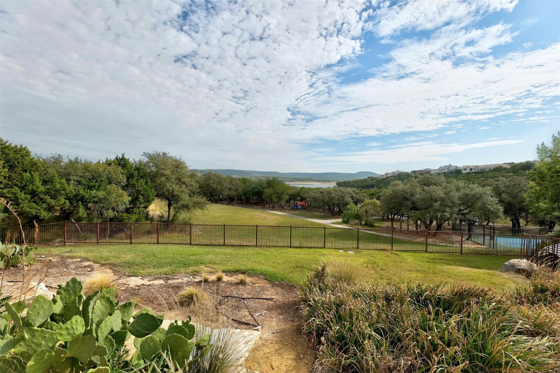 17800 Edgewood Way, Unit 202 Jonestown, TX 78645 - Photo 25 of 40 a view of a lake with a big yard