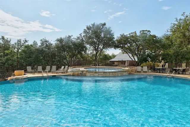 a view of a swimming pool with an outdoor space and seating area