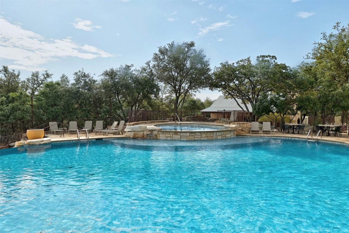 17800 Edgewood Way, Unit 202 Jonestown, TX 78645 - Photo 28 of 40 a view of a swimming pool with an outdoor space and seating area