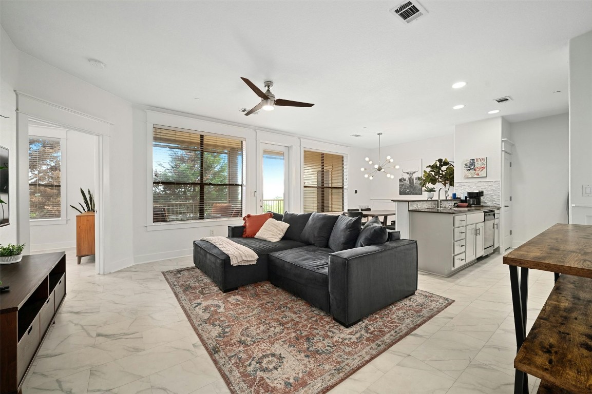 17800 Edgewood Way, Unit 202 Jonestown, TX 78645 - Photo 6 of 40 a living room with furniture and a large window