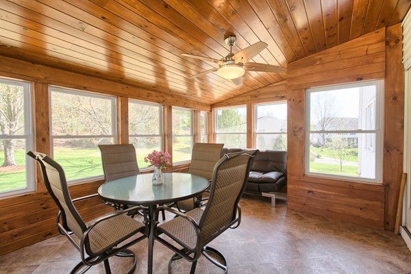 4 Snowberry Road Andover, MA 01810 - Photo 11 of 30 a dining room with furniture a chandelier and wooden floor