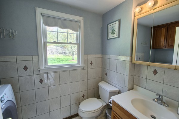 4 Snowberry Road Andover, MA 01810 - Photo 12 of 30 a bathroom with a toilet a sink and a shower