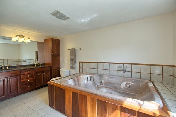 4 Snowberry Road Andover, MA 01810 - Photo 18 of 30 a kitchen with a cabinets and sink
