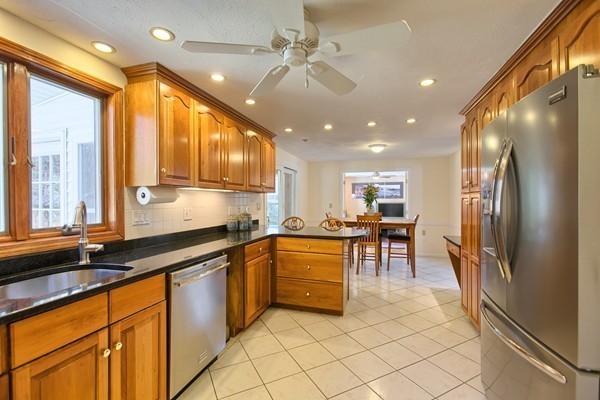 4 Snowberry Road Andover, MA 01810 - Photo 2 of 30 a kitchen with granite countertop sink cabinets and stainless steel appliances