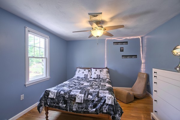 4 Snowberry Road Andover, MA 01810 - Photo 21 of 30 a bed sitting in a bedroom next to a window