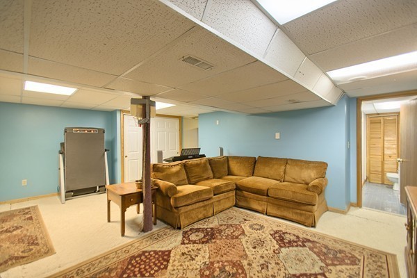 4 Snowberry Road Andover, MA 01810 - Photo 24 of 30 a living room with furniture and a couch