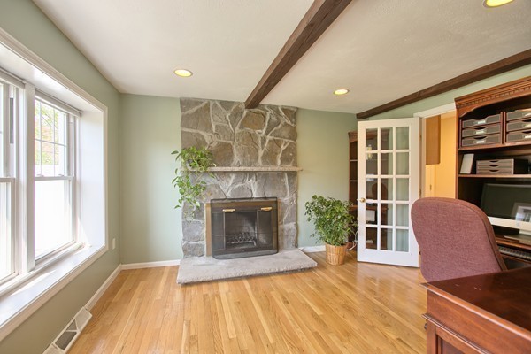 4 Snowberry Road Andover, MA 01810 - Photo 10 of 30 a living room with furniture and a fireplace