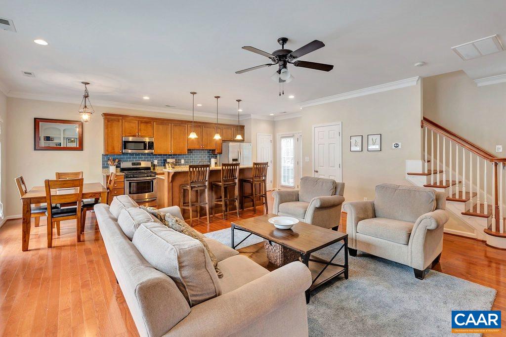 341 Quarry Road Charlottesville, VA 22902 - Photo 5 of 19 a living room with furniture kitchen view and a wooden floor
