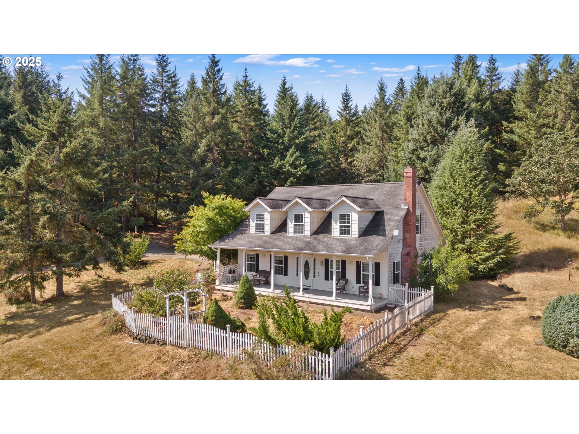 2965 Mistletoe Road Dallas, OR 97338 - Photo 1 of 43 a view of a house with a yard