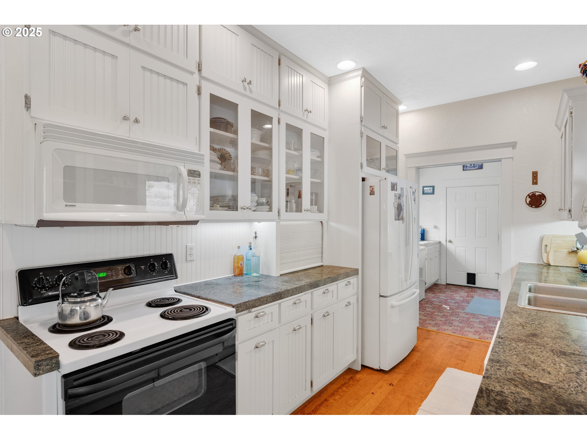 2965 Mistletoe Road Dallas, OR 97338 - Photo 20 of 43 a kitchen with a sink stove and cabinets