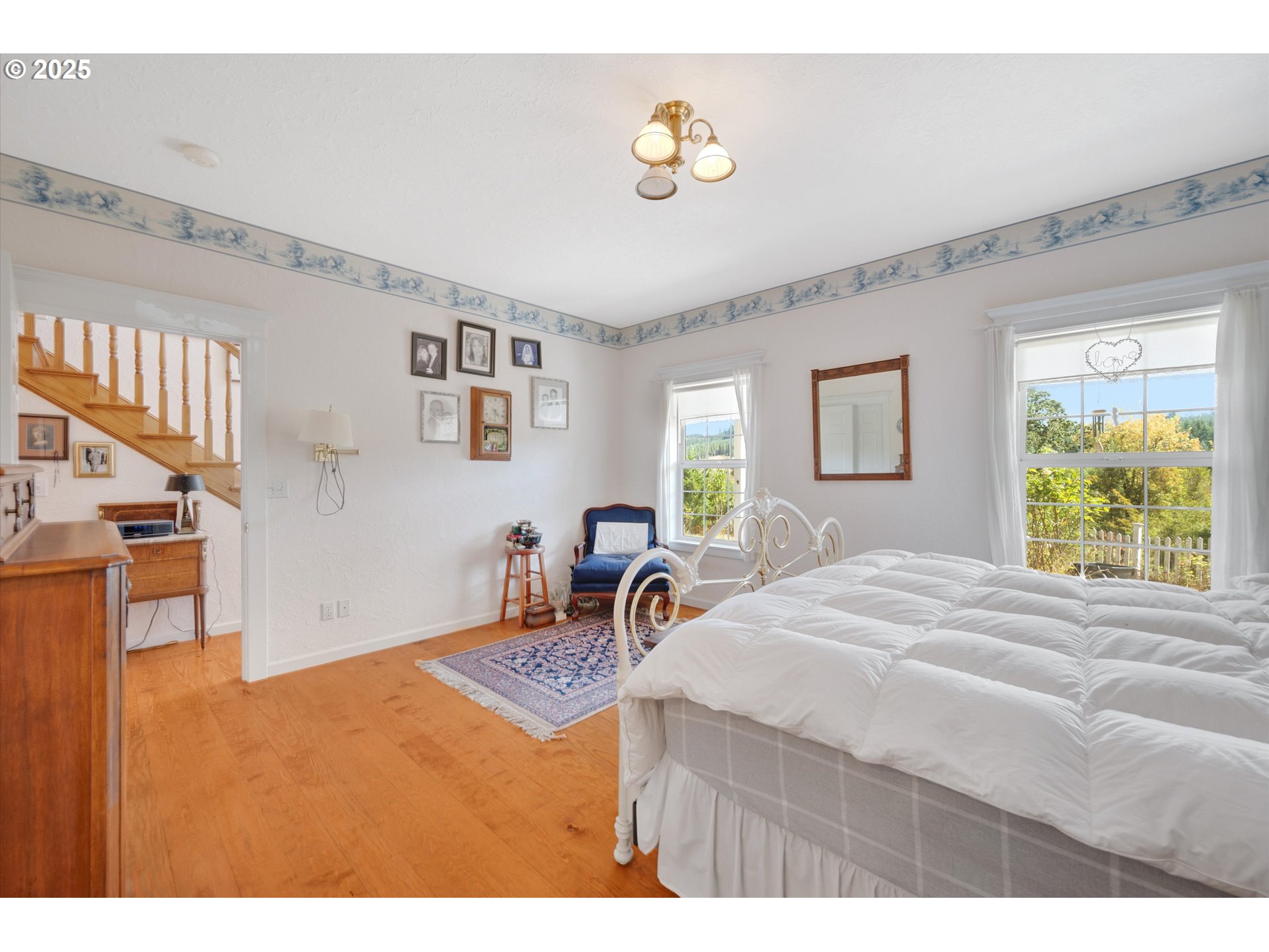 2965 Mistletoe Road Dallas, OR 97338 - Photo 28 of 43 a bedroom with a bed and a window