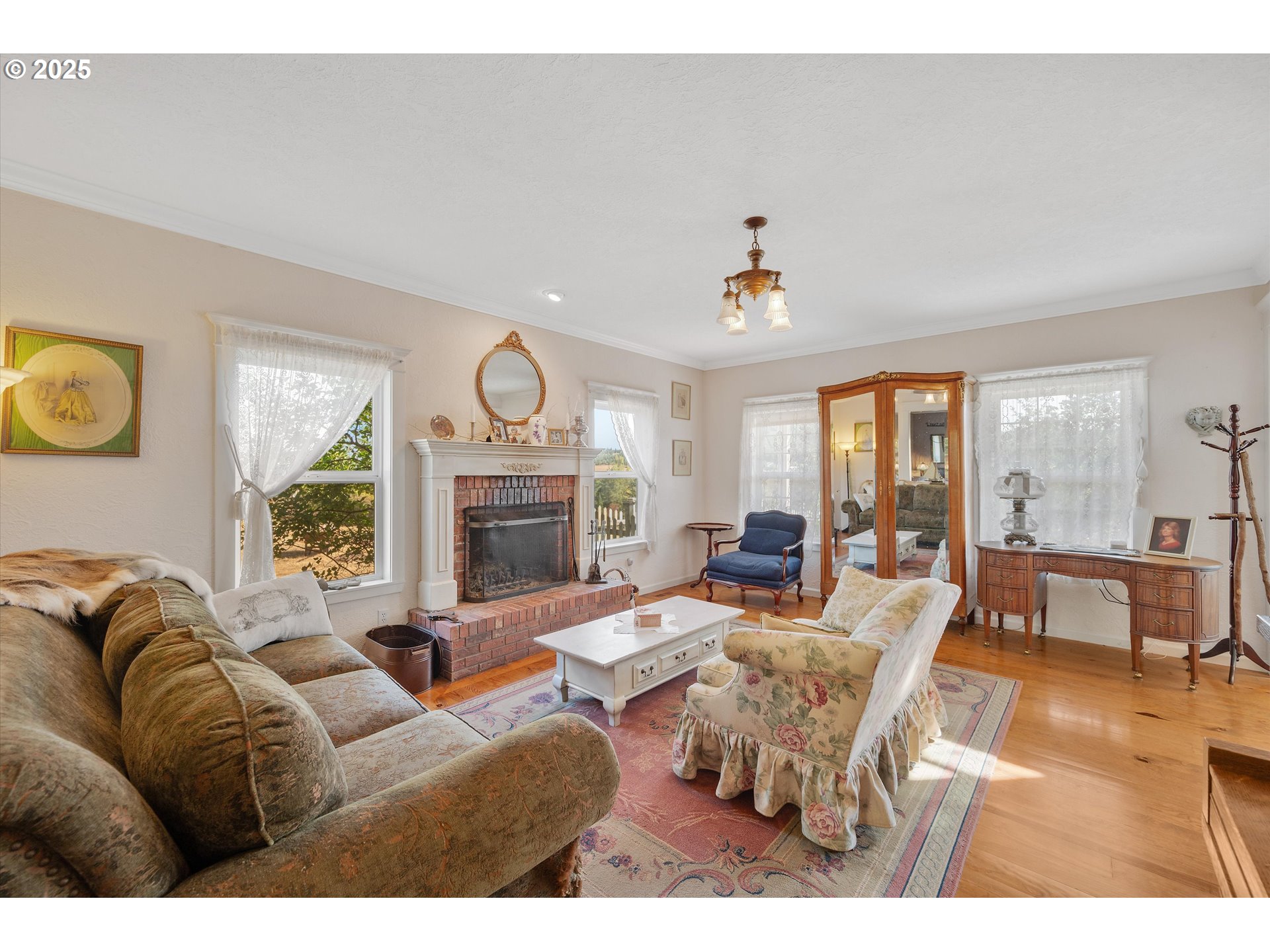 2965 Mistletoe Road Dallas, OR 97338 - Photo 10 of 43 a living room with furniture fireplace and a large window