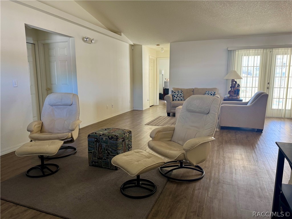 4588 East Van Ness Road Inverness, FL 34453 - Photo 15 of 34 a living room with furniture and a wooden floor