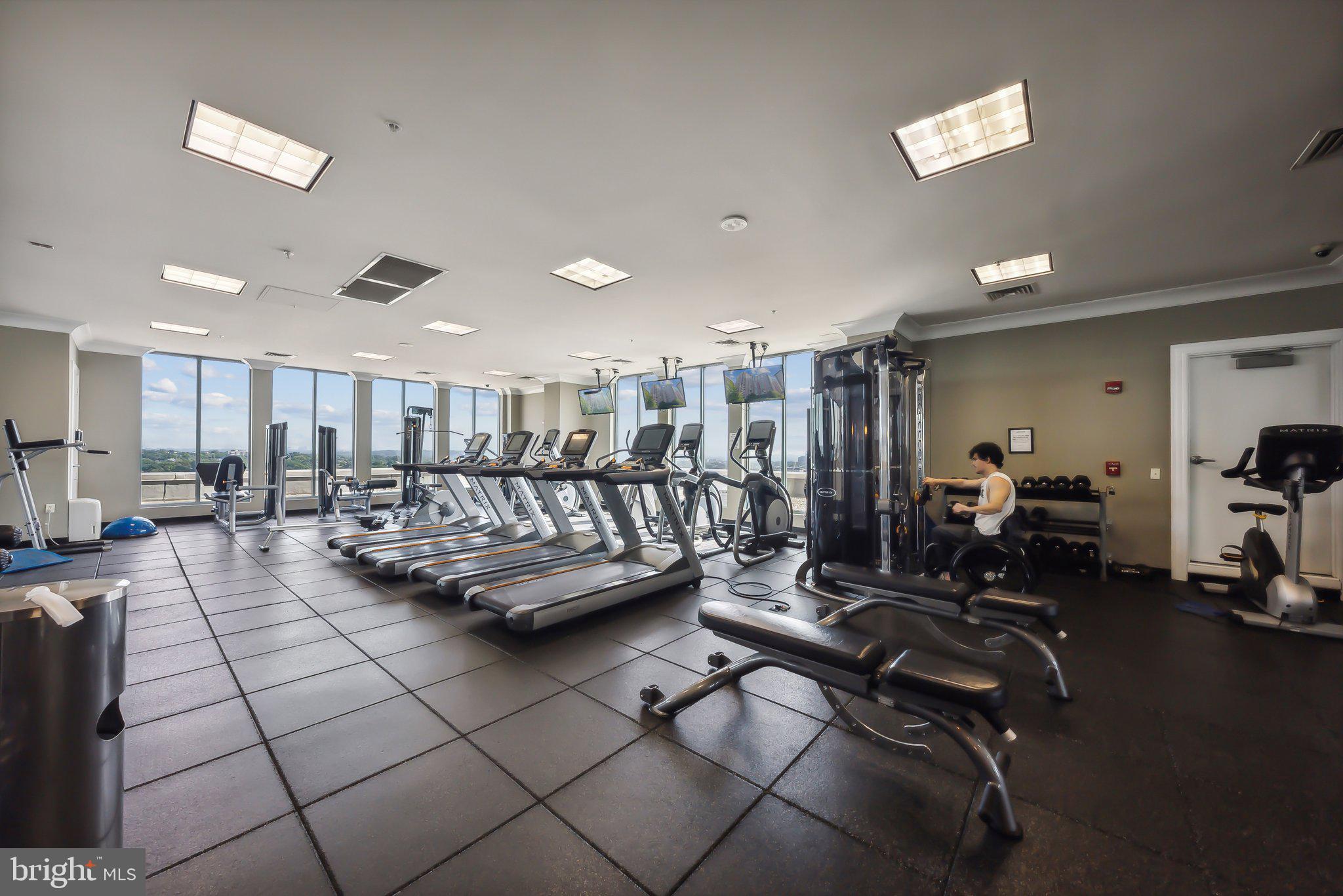 851 North Glebe Road, Unit 2008 Arlington, VA 22203 - Photo 26 of 37 Modern fitness center with skyline views.