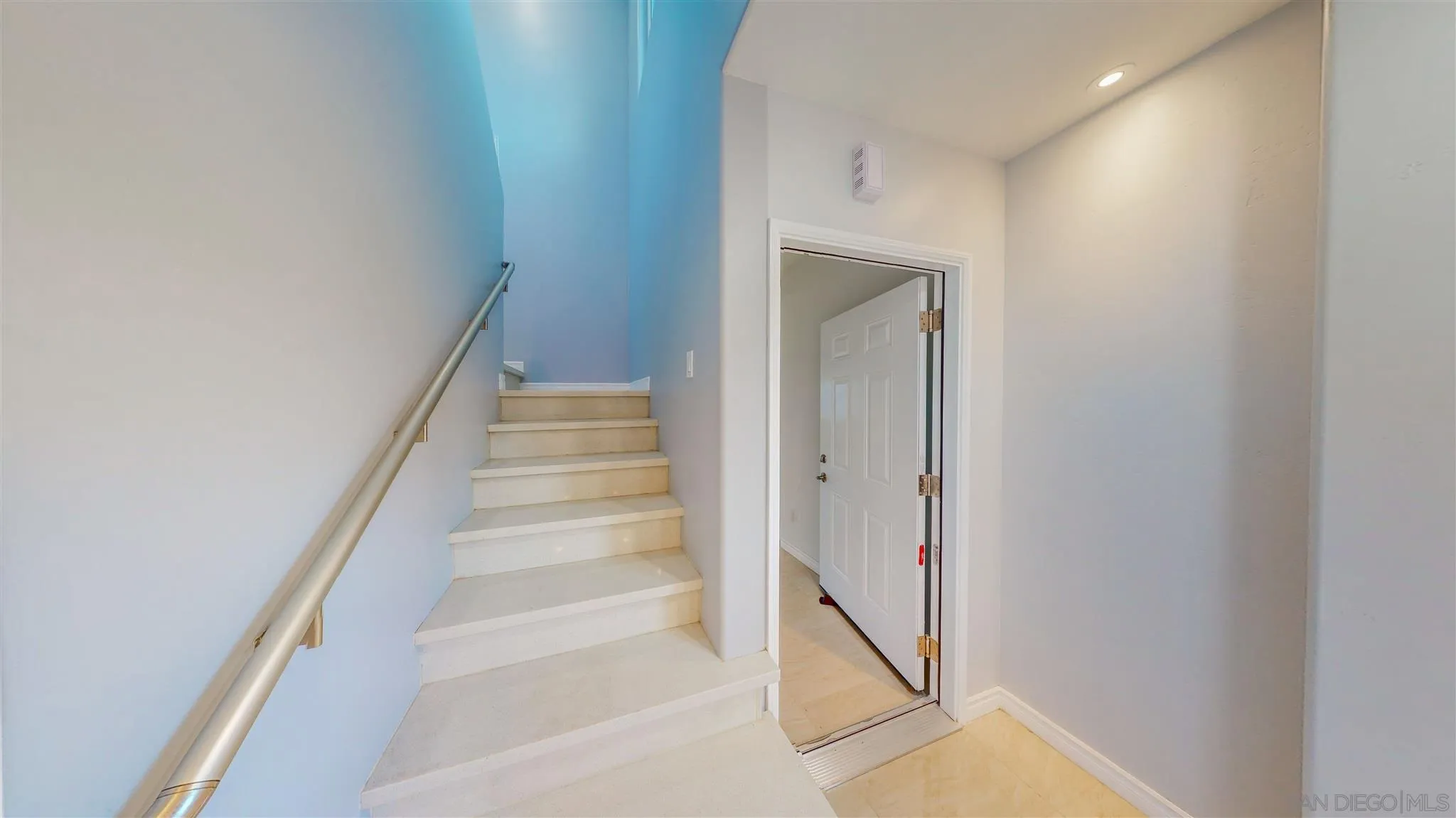9957 Sierra Madre Road Spring Valley, CA 91977 - Photo 14 of 46 a view of staircase with white walls and white door