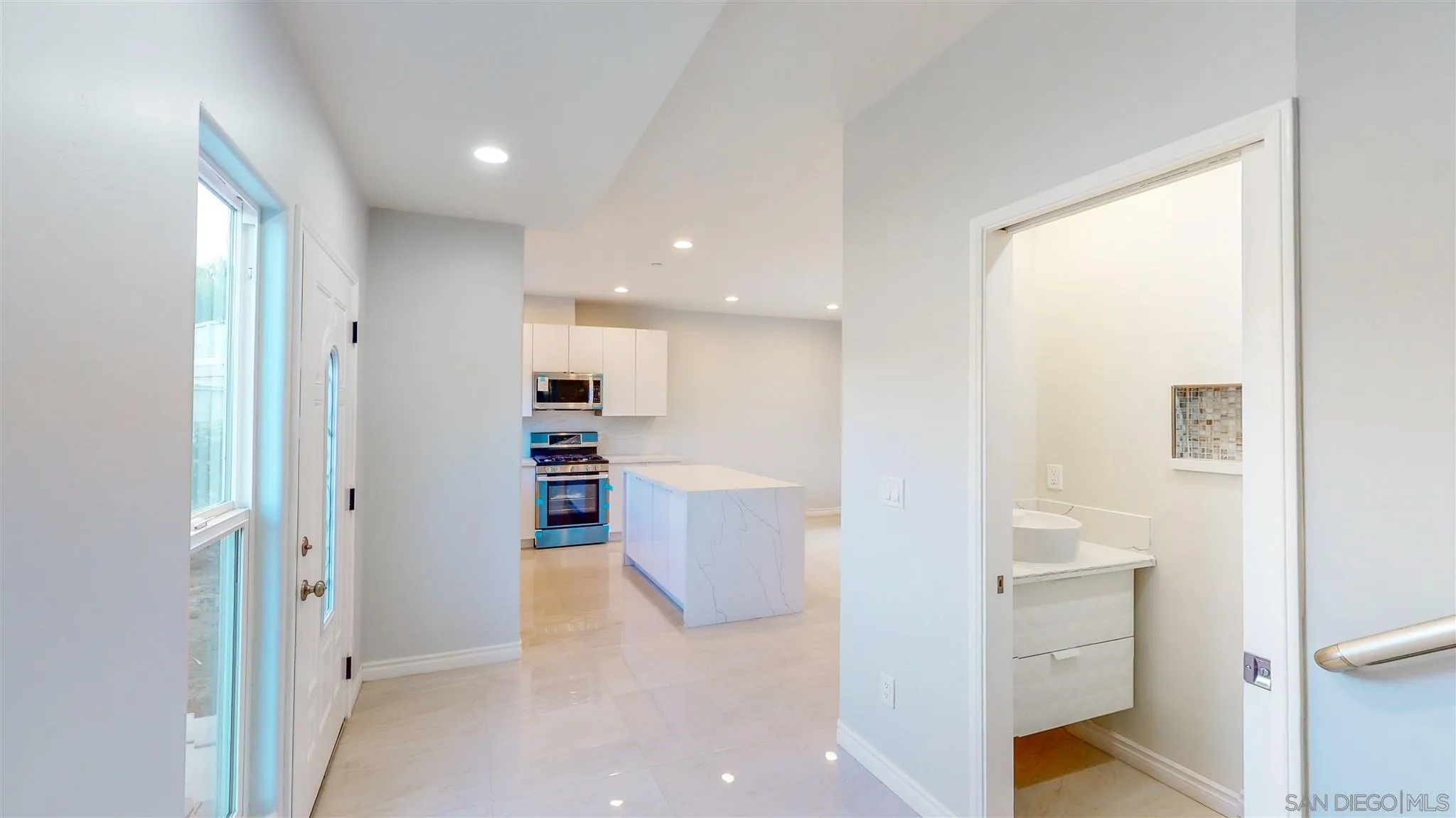 9957 Sierra Madre Road Spring Valley, CA 91977 - Photo 17 of 46 a view of a big room with wooden floor and windows