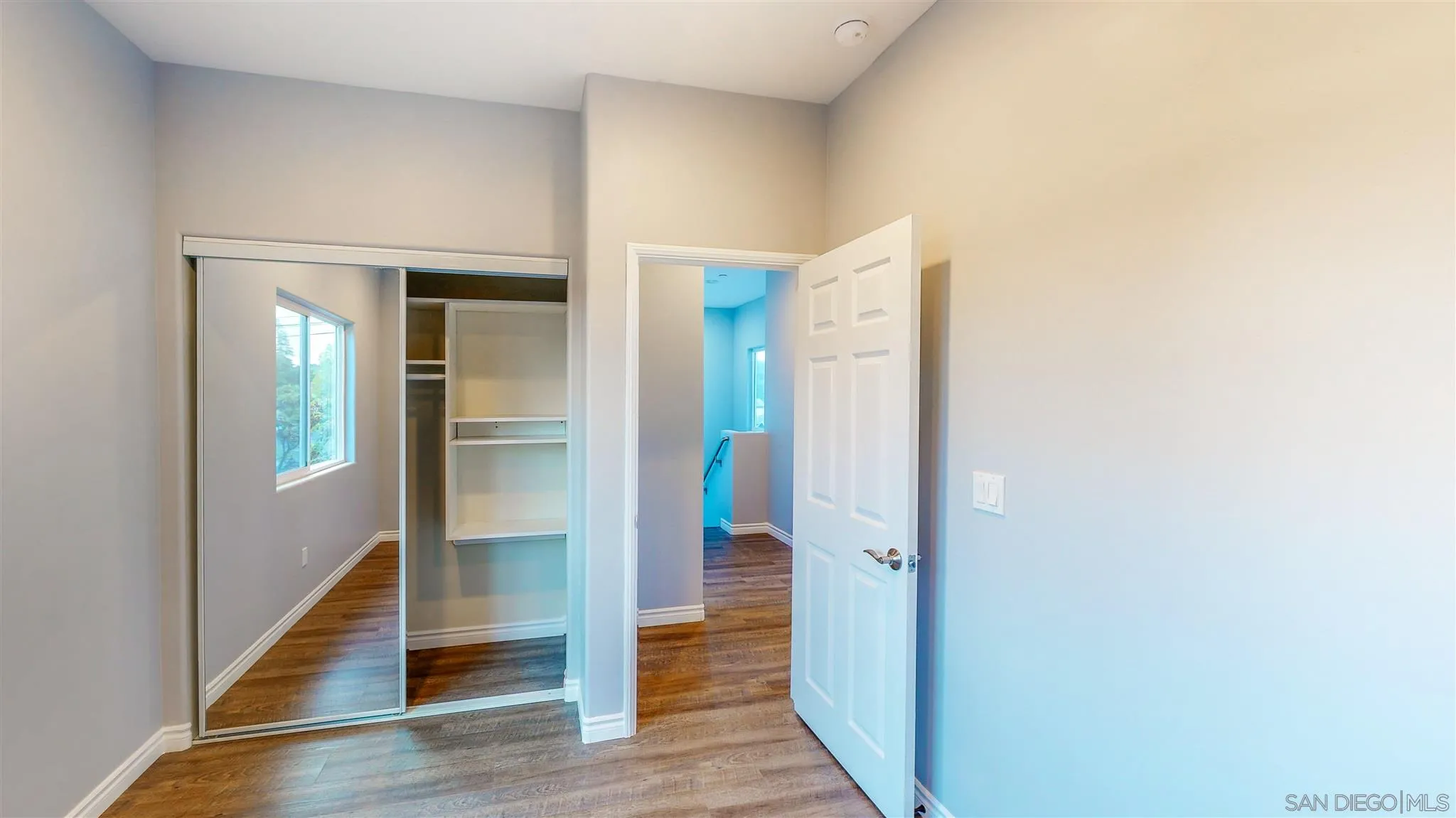 9957 Sierra Madre Road Spring Valley, CA 91977 - Photo 2 of 46 a view of a hallway with wooden floor
