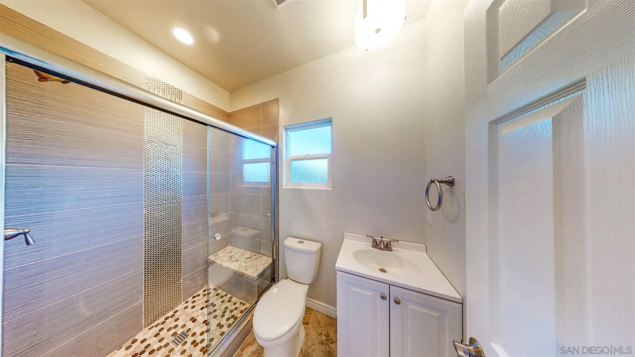 9957 Sierra Madre Road Spring Valley, CA 91977 - Photo 26 of 46 a bathroom with a sink toilet and shower