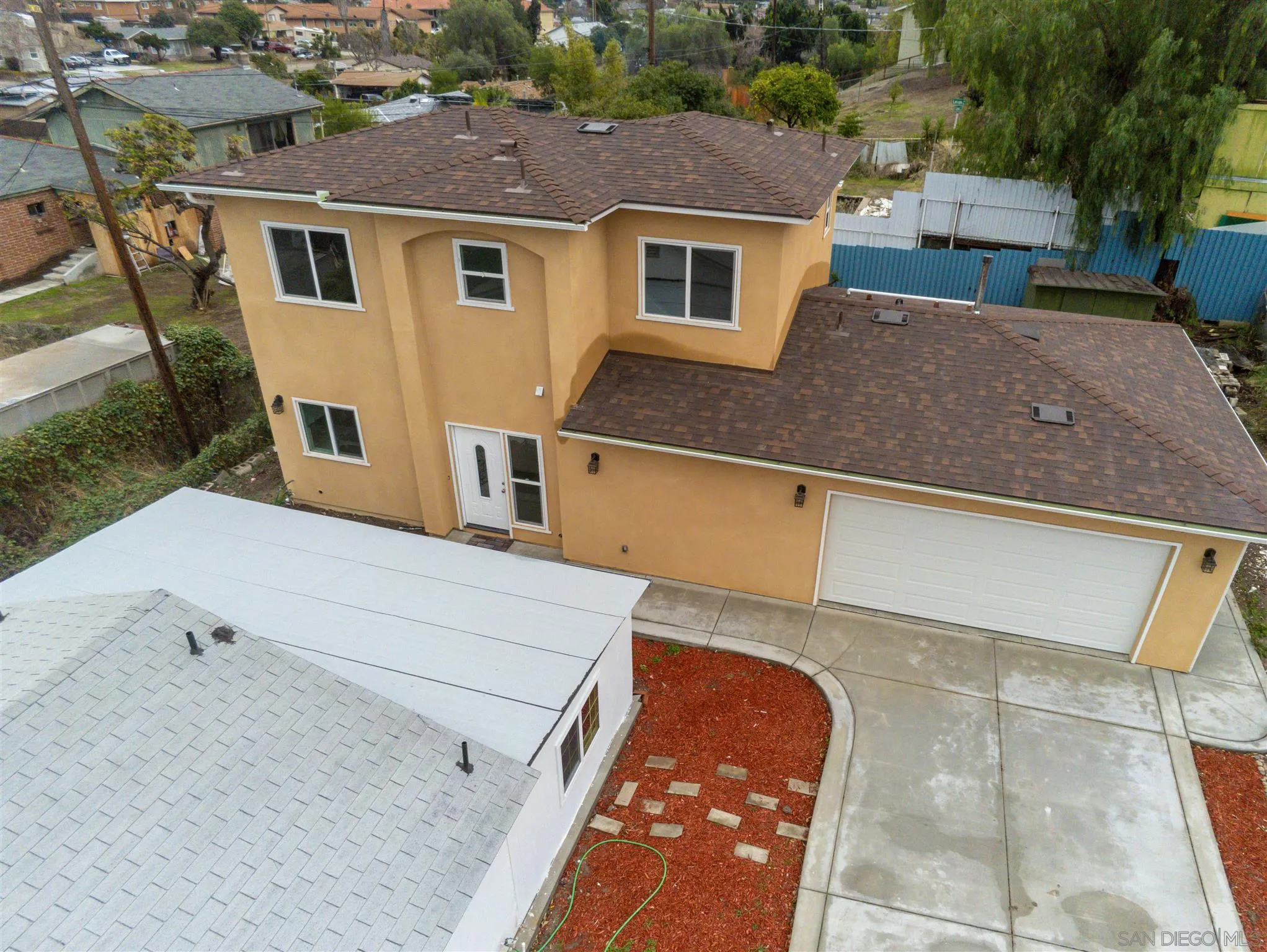 9957 Sierra Madre Road Spring Valley, CA 91977 - Photo 29 of 46 a front view of a house with a yard