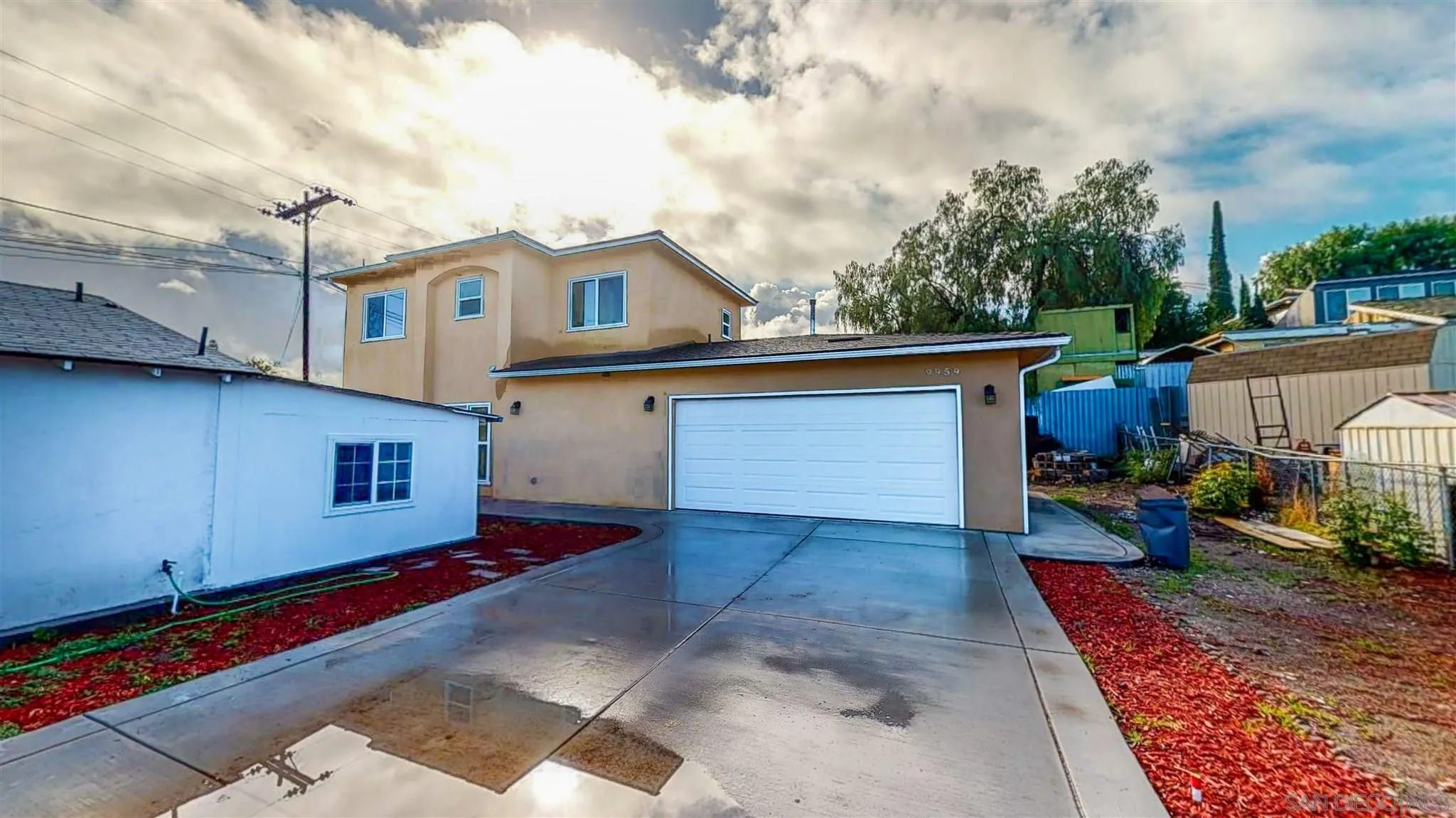 9957 Sierra Madre Road Spring Valley, CA 91977 - Photo 4 of 46 a view of a house with a yard