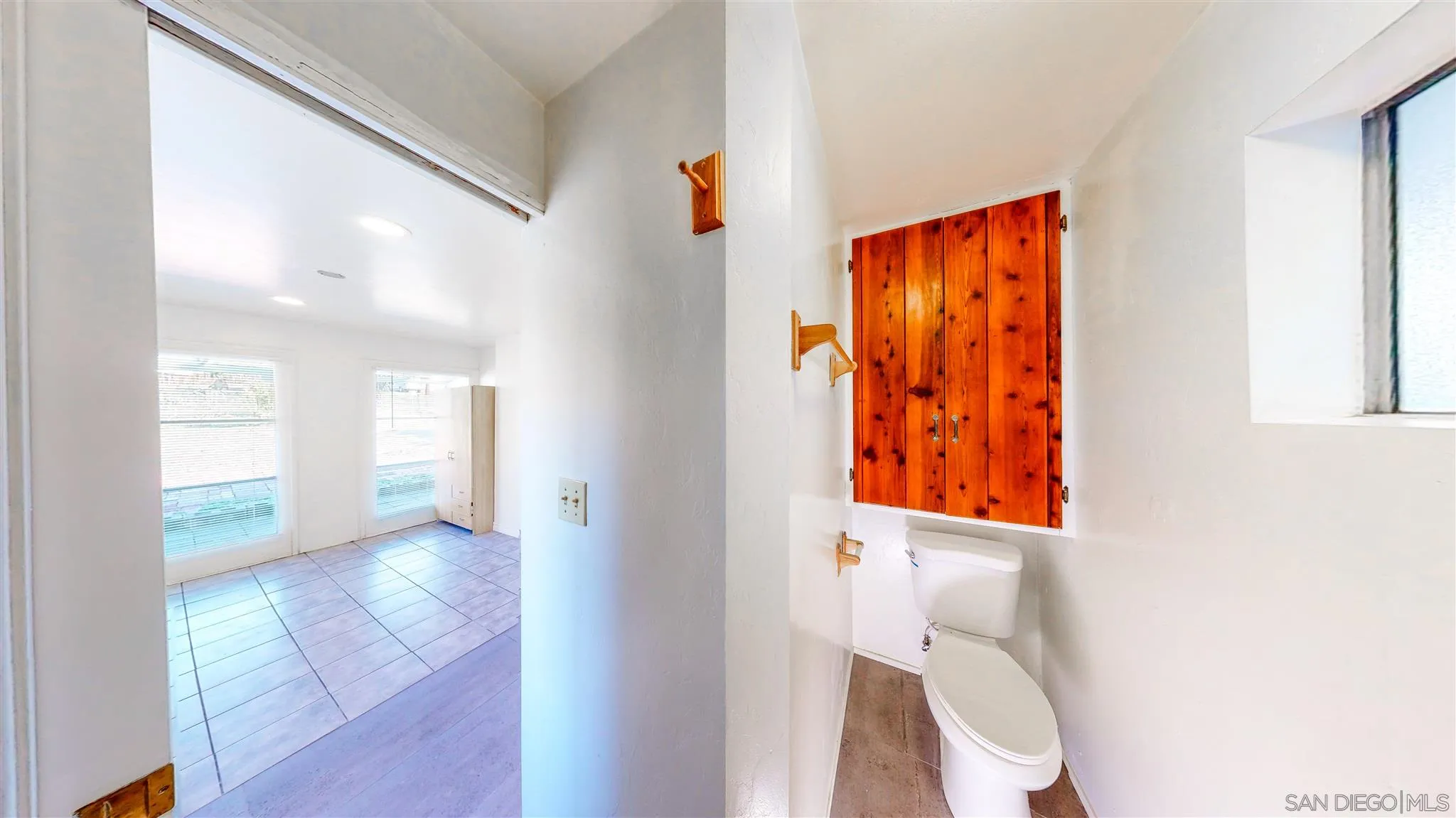 9957 Sierra Madre Road Spring Valley, CA 91977 - Photo 42 of 46 a bathroom with a toilet and a shower