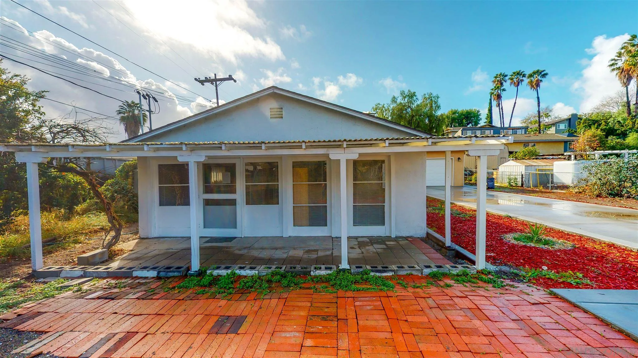 9957 Sierra Madre Road Spring Valley, CA 91977 - Photo 46 of 46 a front view of a house with garden