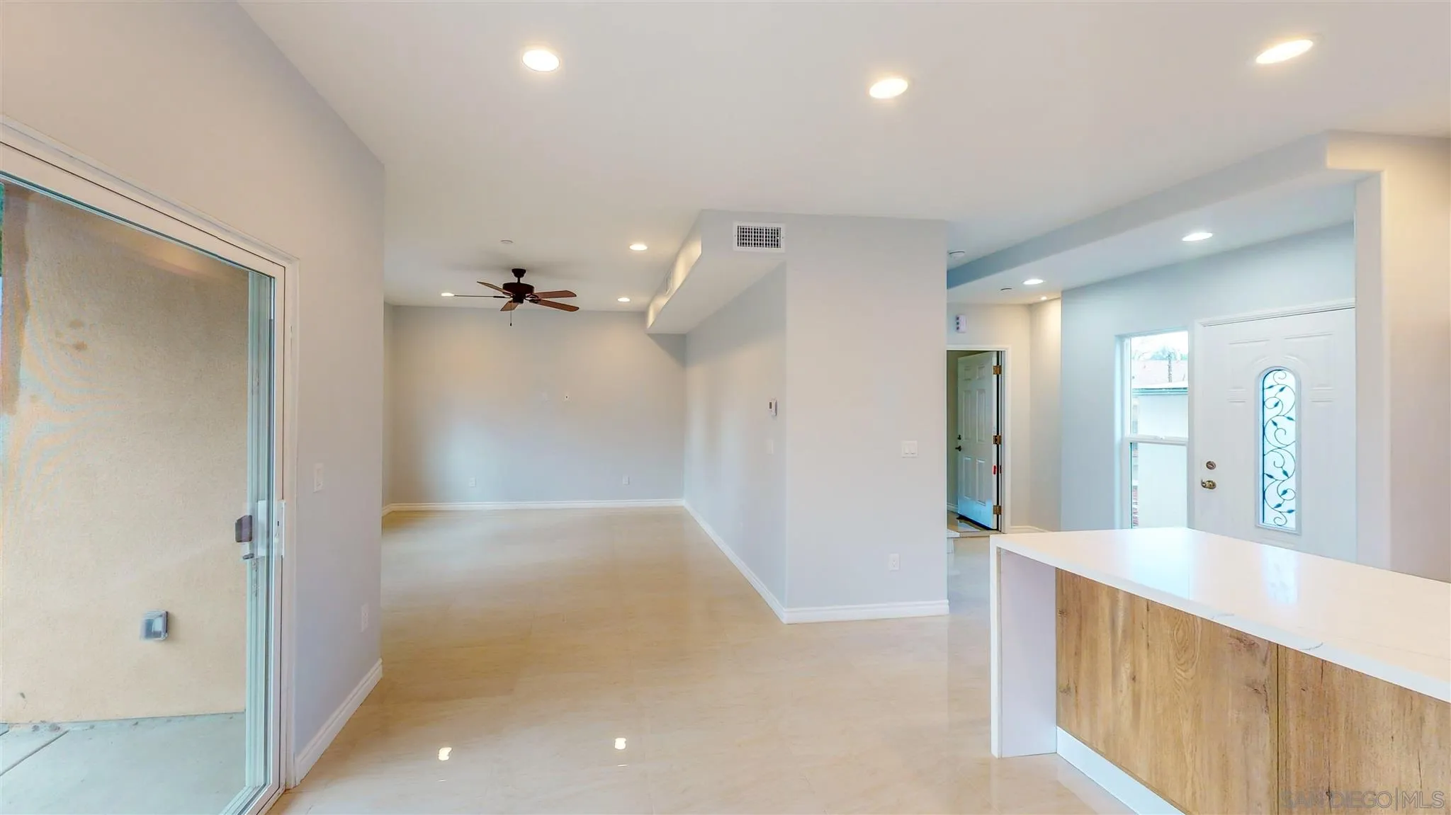 9957 Sierra Madre Road Spring Valley, CA 91977 - Photo 8 of 46 a view of hallway with a mirror and a shower