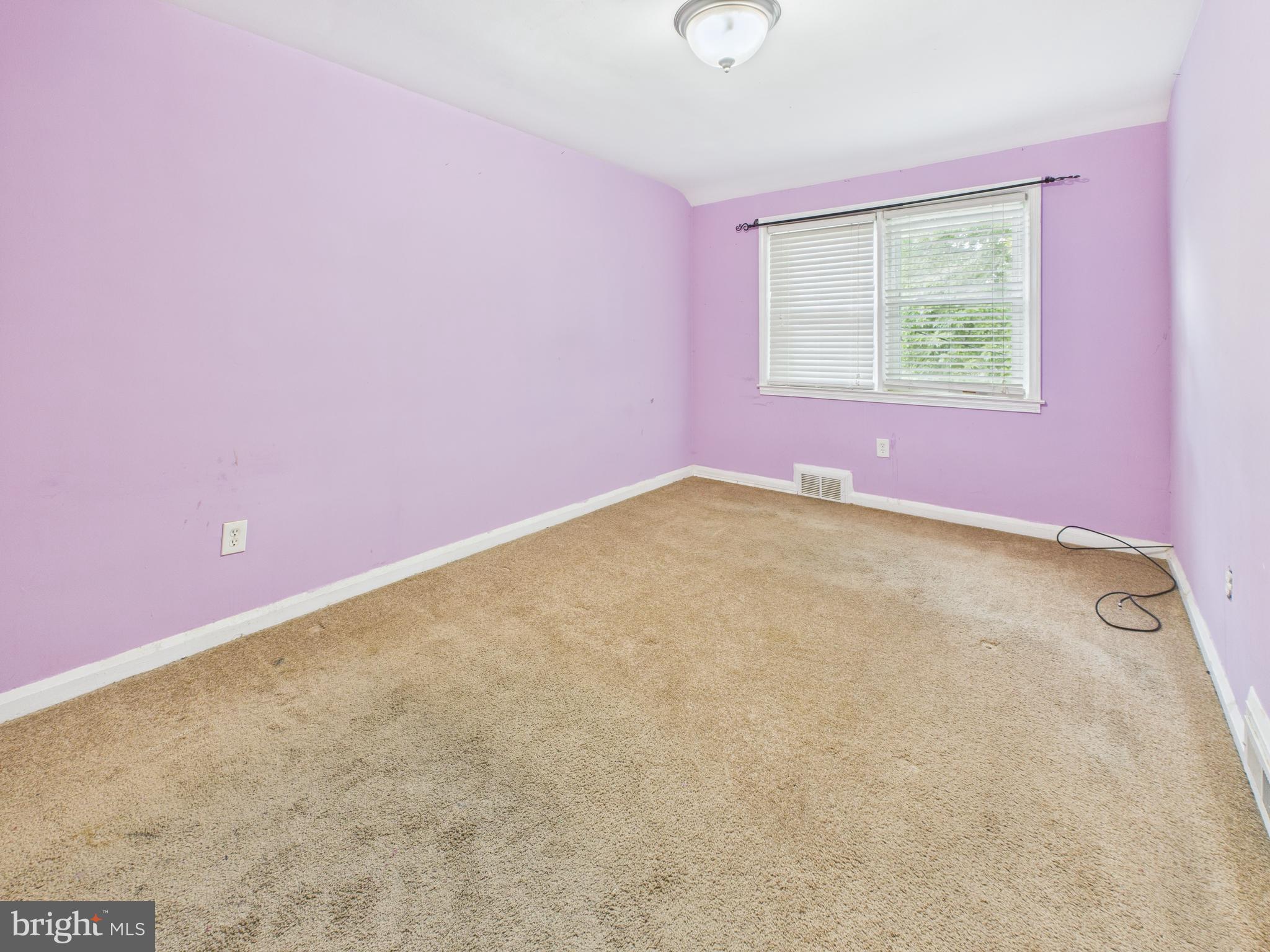 1206 Cedarcroft Road Baltimore, MD 21239 - Photo 13 of 29 an empty room with windows