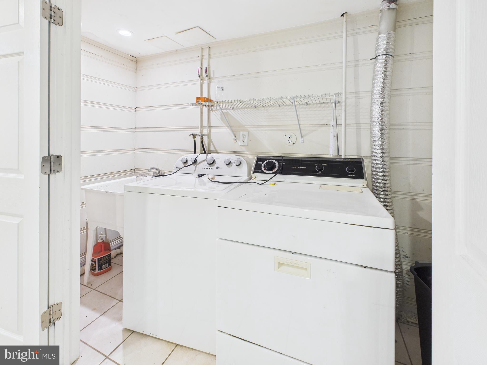 1206 Cedarcroft Road Baltimore, MD 21239 - Photo 19 of 29 a utility room with dryer and washer