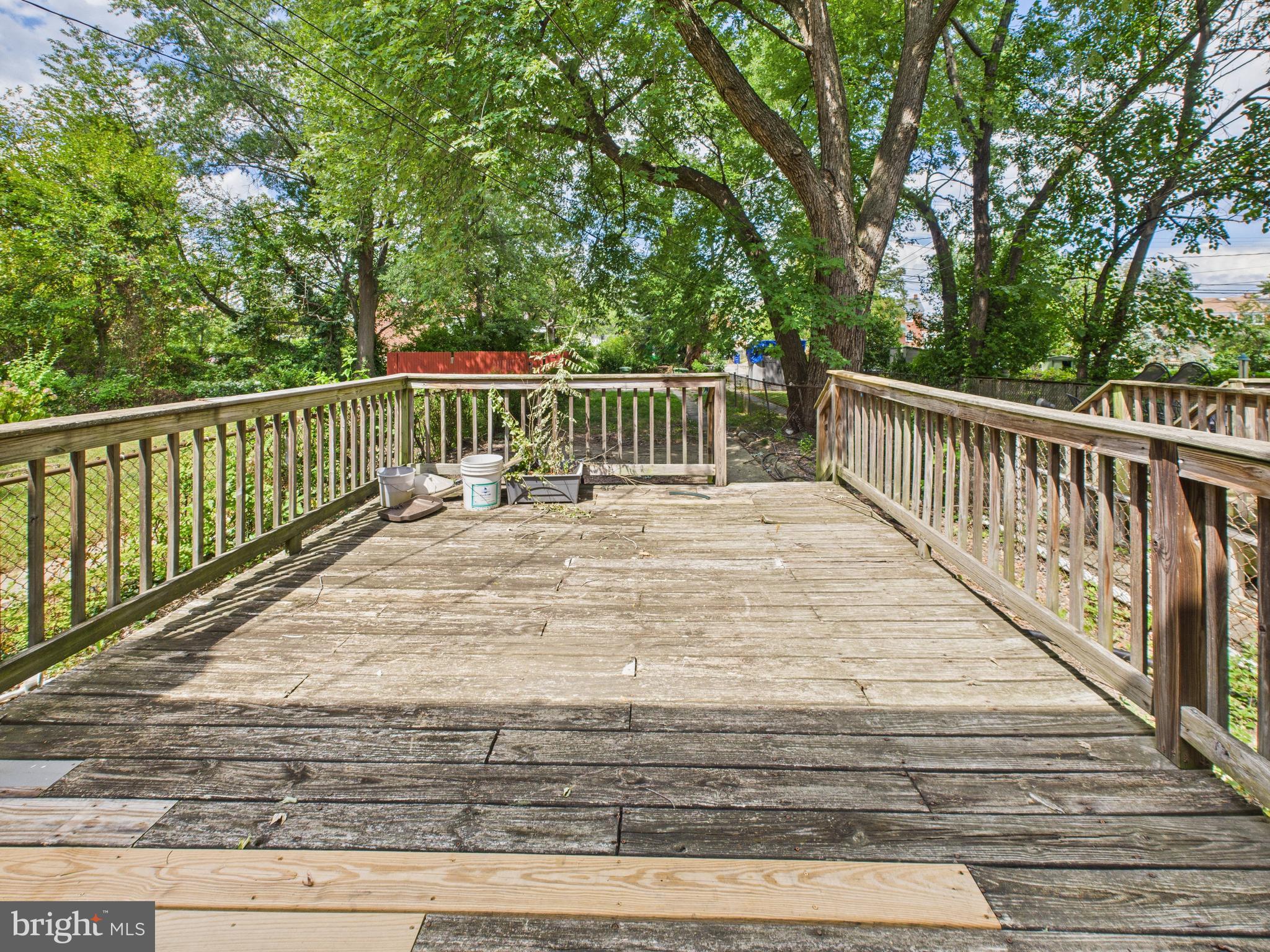 1206 Cedarcroft Road Baltimore, MD 21239 - Photo 23 of 29 a balcony with trees