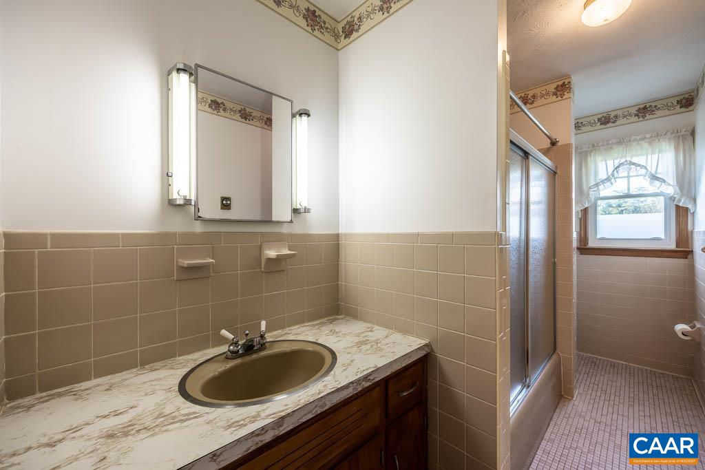144 Dairy Road Ruckersville, VA 22968 - Photo 19 of 33 a bathroom with a sink and a mirror