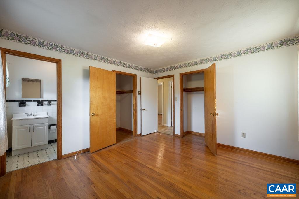 144 Dairy Road Ruckersville, VA 22968 - Photo 23 of 33 a view of empty room with cabinet and wooden floor
