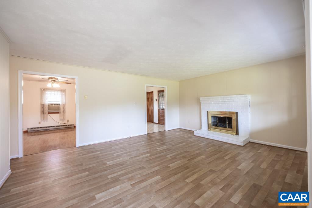 144 Dairy Road Ruckersville, VA 22968 - Photo 25 of 33 a view of an empty room with window and wooden floor