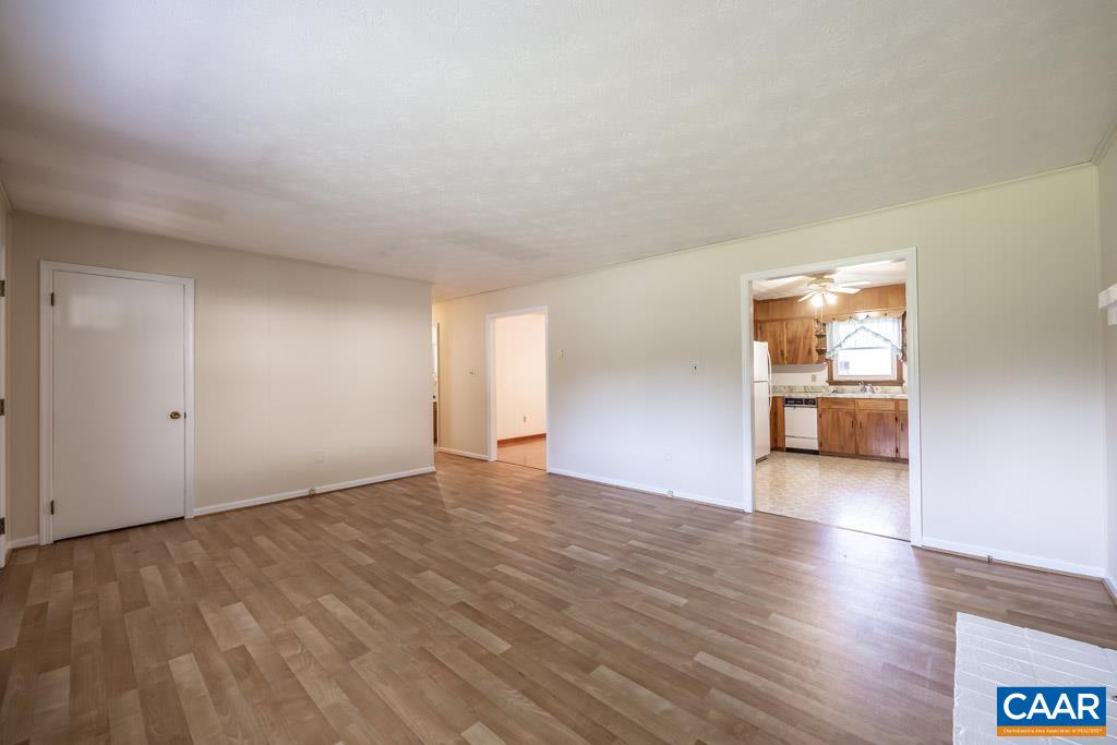 144 Dairy Road Ruckersville, VA 22968 - Photo 28 of 33 a view of an empty room with window and wooden floor