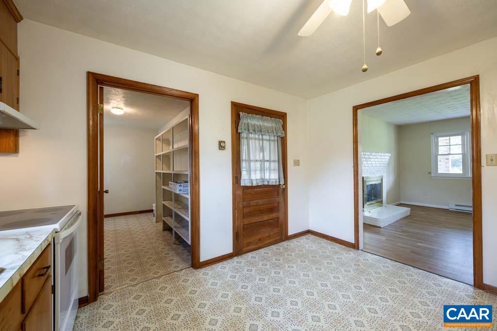 144 Dairy Road Ruckersville, VA 22968 - Photo 32 of 33 a view of a hallway with bathroom and wooden floor