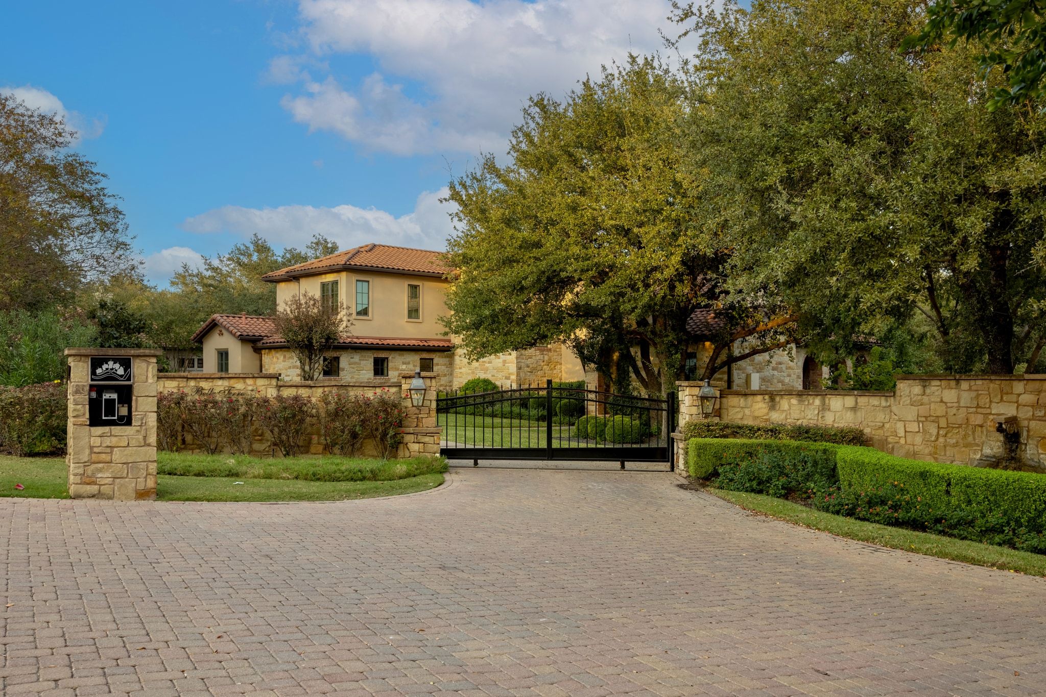 4720 Rockcliff Road, Unit 1 Austin, TX 78746 - Photo 39 of 39 Grand wrought iron gate and paved drive.
