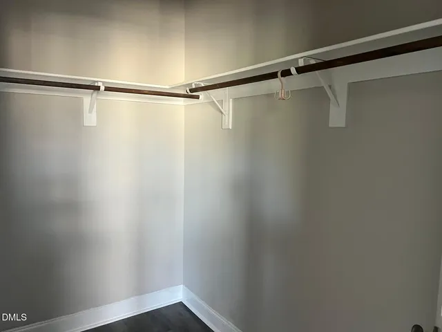 a view of a balcony with a floor to ceiling window wooden floor