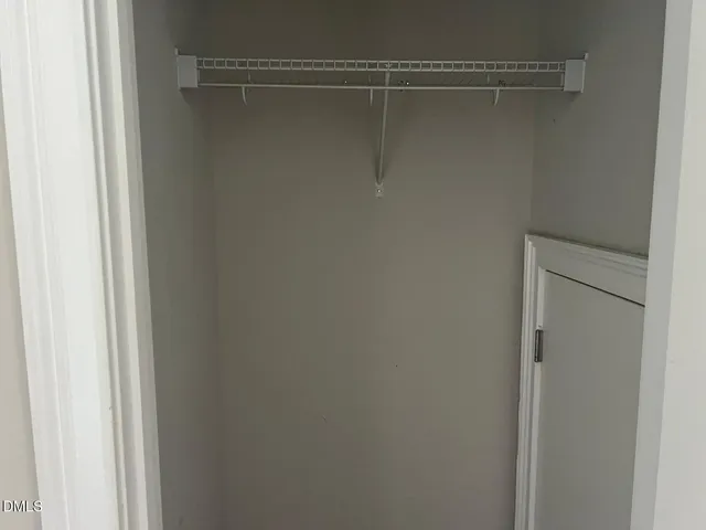 a view of a park with iron fence