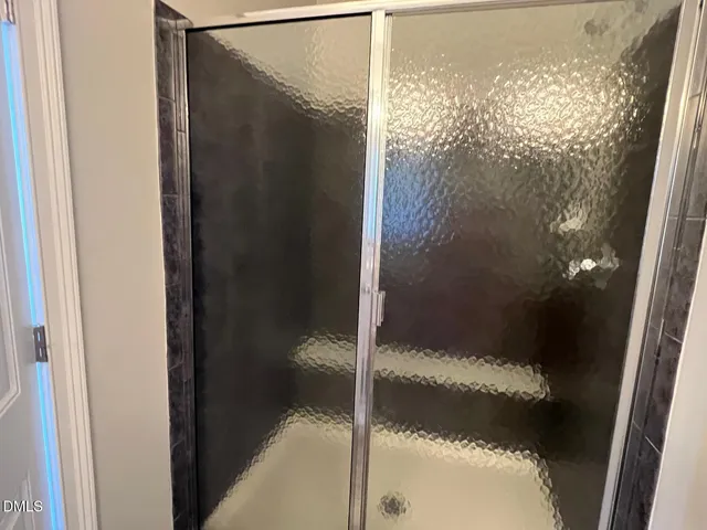 front view of a brick house with a clock tower in front of it