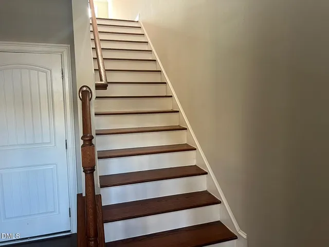 a kitchen with stainless steel appliances a refrigerator sink and microwave