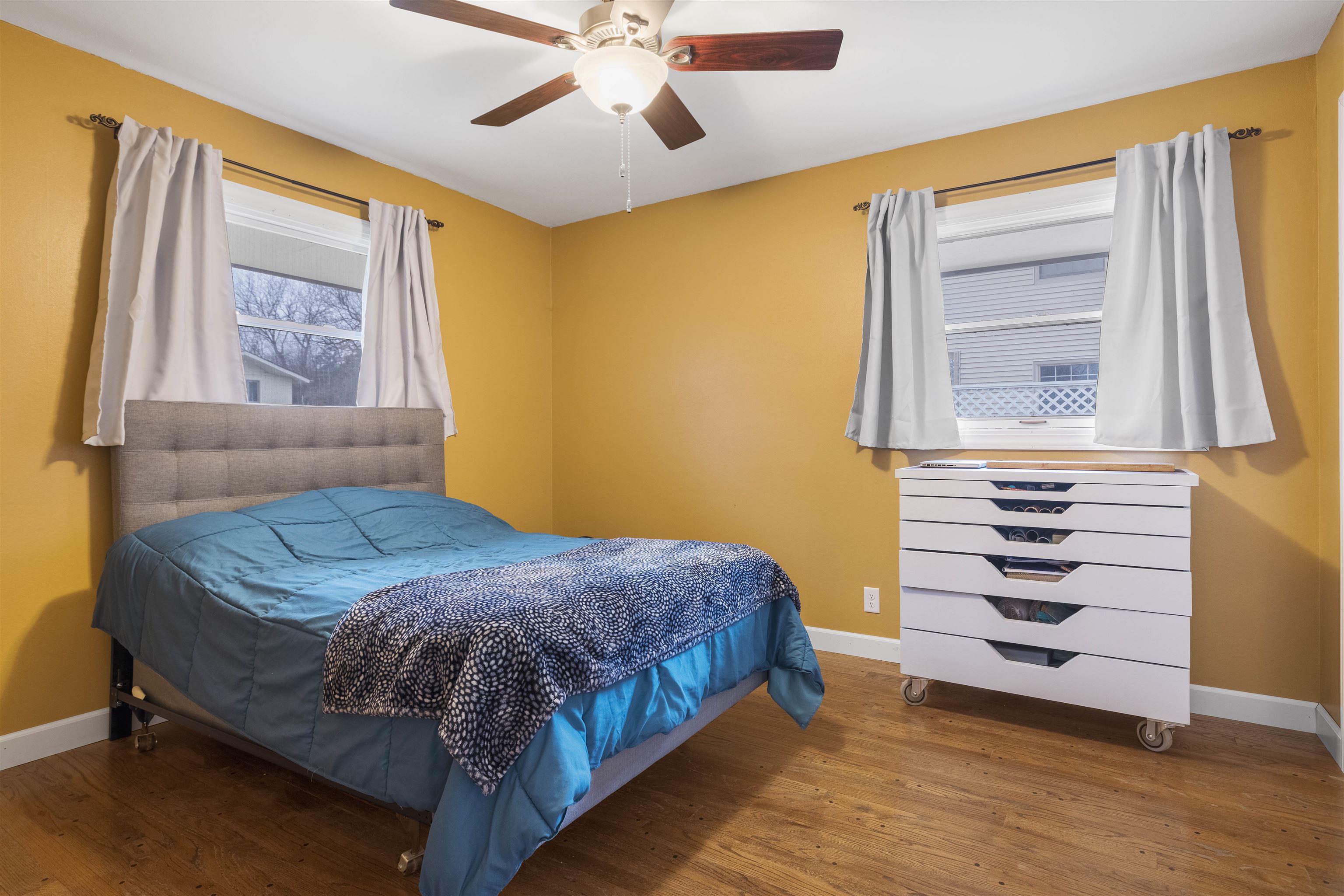 4711 Brookview Road Rockford, IL 61107 - Photo 11 of 26 a bedroom with a bed and a window